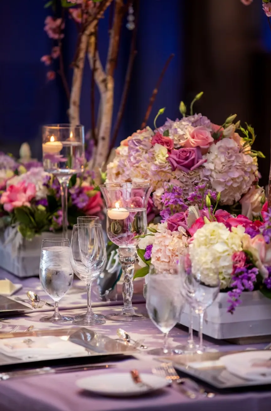 Hydrangea and rose centerpieces with floating candles